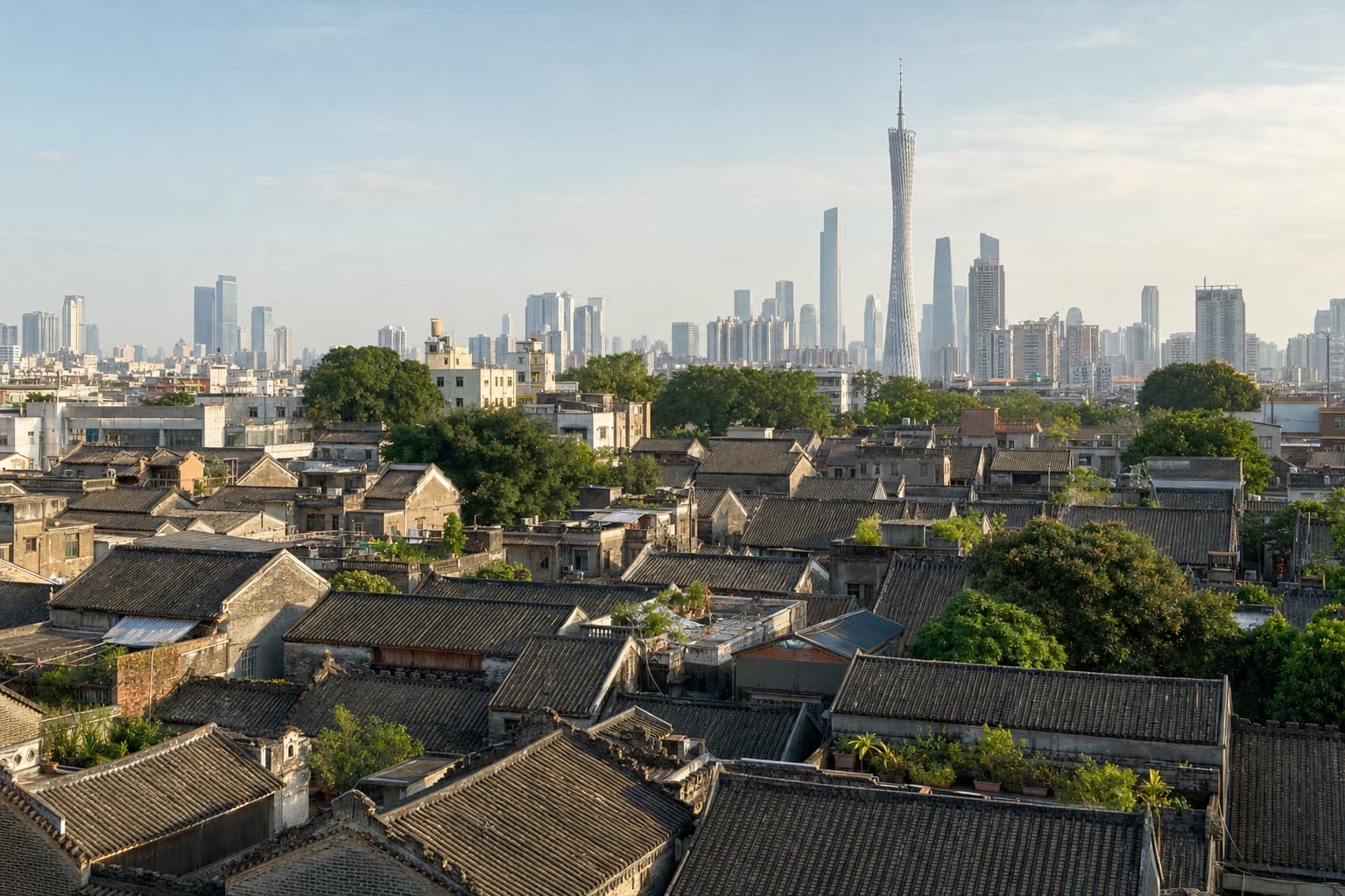 Traditional Guangzhou rooftops with Canton Tower in the distance